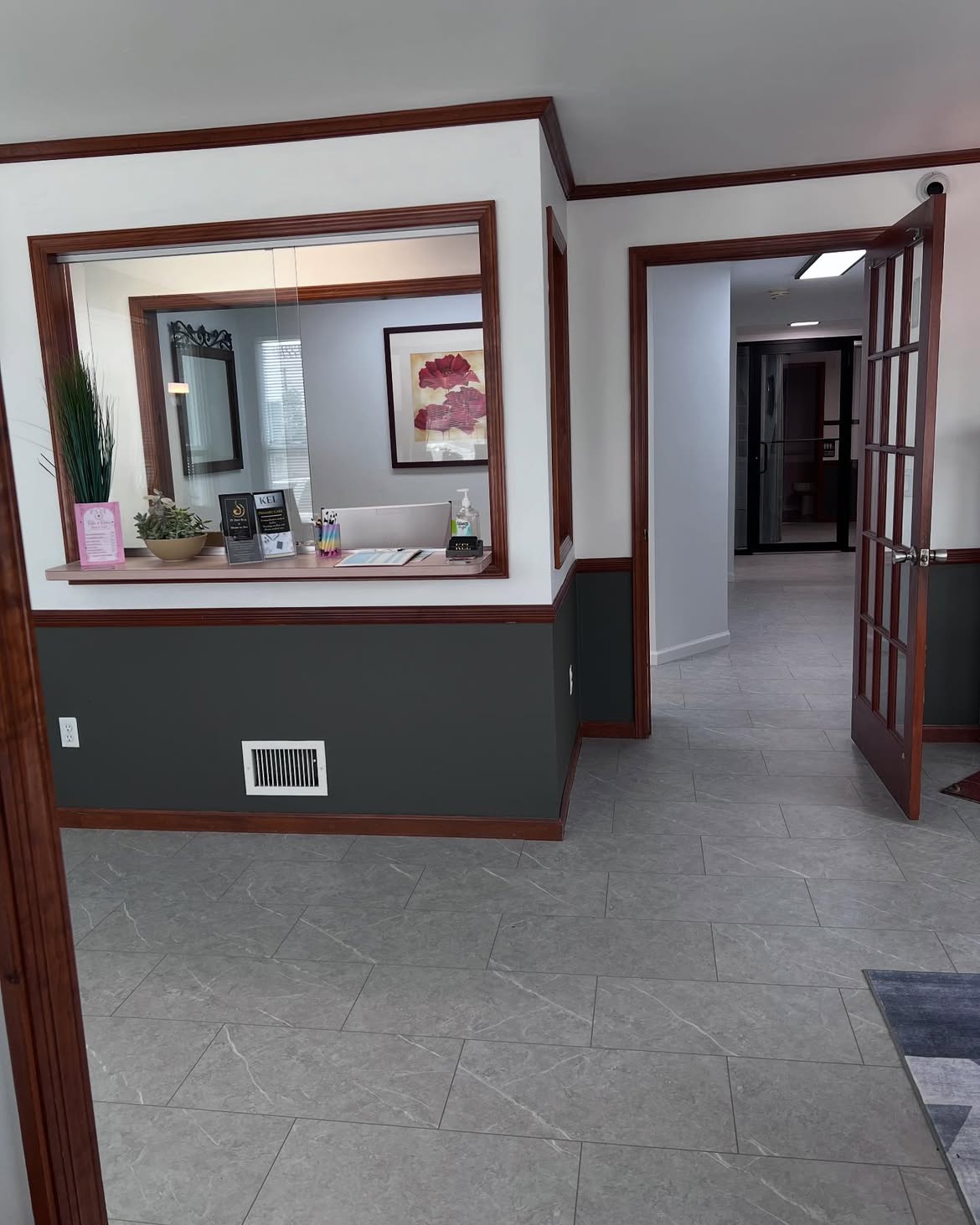 The reception window at the Wading River clinic, opening onto the hallway that leads to the exam rooms.